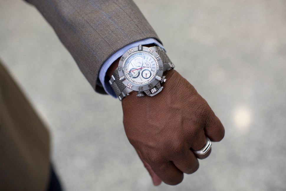 Anthony Williams shows the watch he wears in court. 