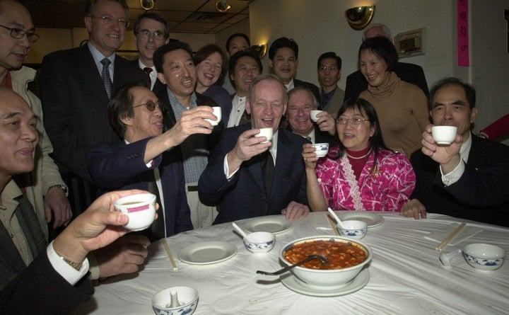 Jean Chrétien has tea with members of Toronto's Chinese community in response to SARS fears which hurt Chinese businesses, on Apr. 10, 2003.