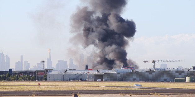 MELBOURNE, AUSTRALIA - FEBRUARY 21: A view from the tarmac at Melbourne's Essendon Airport is seen after a charter plane leaving the airport crashed on February 21, 2017 in Melbourne, Australia. The charter plane was carrying 5 people when it crashed near the DFO Melbourne Shopping Centre at around 9am this morning. Emergency services are on scene. (Photo by Michael Dodge/Getty Images)