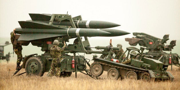 Romanian Army soldiers deploy a HAWK PIP III R ground-to-air missile launch pad during a joint military exercise with the US Army that aimed to test the interoperability of U.S. and Romanian armed forces in the event of a missile attack, near Corbu village in Constanta county, Romania, November 8, 2016. Inquam Photos/Ovidiu Micsik/via REUTERS ATTENTION EDITORS - THIS IMAGE WAS PROVIDED BY A THIRD PARTY. EDITORIAL USE ONLY. ROMANIA OUT. NO COMMERCIAL OR EDITORIAL SALES IN ROMANIA.