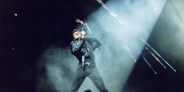 LONDON, UNITED KINGDOM - JUNE 15: George Michael performs on stage on his 'Faith' tour, at Earls Court Arena on June 15th, 1988 in London, England. (Photo by Peter Still/Redferns)