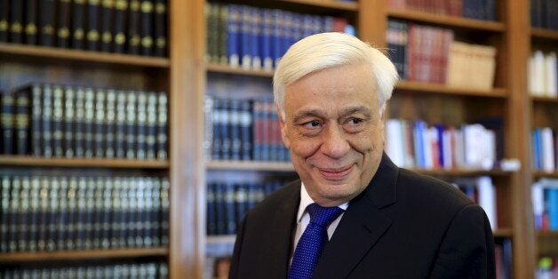 Greek President Prokopis Pavlopoulos looks on before a meeting with Popular Unity far-left leader Panagiotis Lafazanis (unseen) at the Presidential Palace in Athens, GreeceAugust 27, 2015. Greece's far-left leader on Thursday formally gave up a bid to form a coalition government, allowing the country's president to finally set a date for early elections after a week of fruitless political wrangling. REUTERS/Alkis Konstantinidis