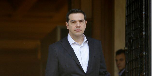 Greece's Prime Minister Alexis Tsipras waits for European Council President Donald Tusk before their meeting at Maximos Mansion in Athens on Thursday, March 3, 2016. The government said it has requested 480 million euros ($520 million) in aid for the refugee crisis from the EU, under an emergency plan to cope with as many as 100,000 stranded refugees - roughly three times the number now stuck inside Greece. (AP Photo/Thanassis Stavrakis)