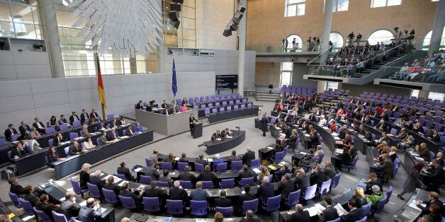Lawmakers attend a debate at the German Federal Parliament, Bundestag, in Berlin, Germany, Friday, April 24, 2015. Germany's parliamentary speaker Norbert Lammert said the slaughter of Armenians by Ottoman Turks 100 years ago was genocide, saying Germany's own past makes it important to speak out. (AP Photo/Michael Sohn)