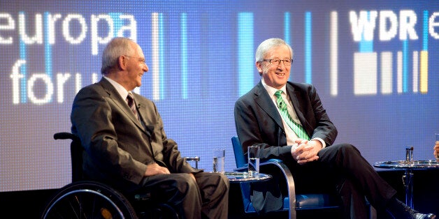 German finance minister Wolfgang Schaeuble (L) and prime minister of Luxemburg Jean-Claude Juncker (R) take part in a panel discussion during the WDR (West Deutche Rundfunk) Europe forum conference at the foreign ministry in Berlin on May 16, 2013. AFP PHOTO / ODD ANDERSEN (Photo credit should read ODD ANDERSEN/AFP/Getty Images)