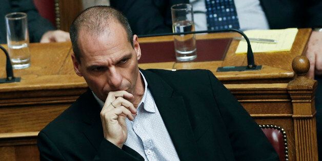 Greek Finance Minister Yanis Varoufakis listens the speech of Greek Premier during a parliamentary session, in Athens, on Monday, March 30, 2015, after Greece's Prime Minister Alexis Tsipras called the special session of parliament to brief lawmakers on the course of recent troubled negotiations with bailout lenders to overhaul cost-cutting reforms. Greece is under pressure to convince creditors it has viable alternatives to the reforms, with government cash reserves running low. (AP Photo/Petros Giannakouris) (