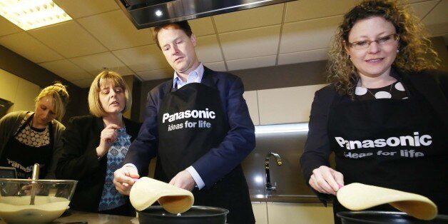 Liberal Democrat leader Nick Clegg with Sue O'Donnell (second left) and Jenny Willott (right) making pancakes during their visit to the Panasonic Manufacturing site in Cardiff while on the General Election campaign trail.