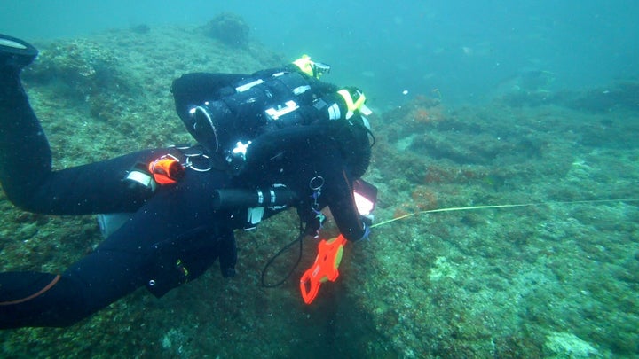 Michael Barnette measuring the wreck of the SS Cotopaxi.