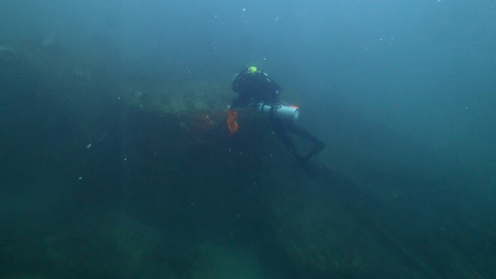 Diver Joe Citelli inspecting the wreck of the SS Cotopaxi.