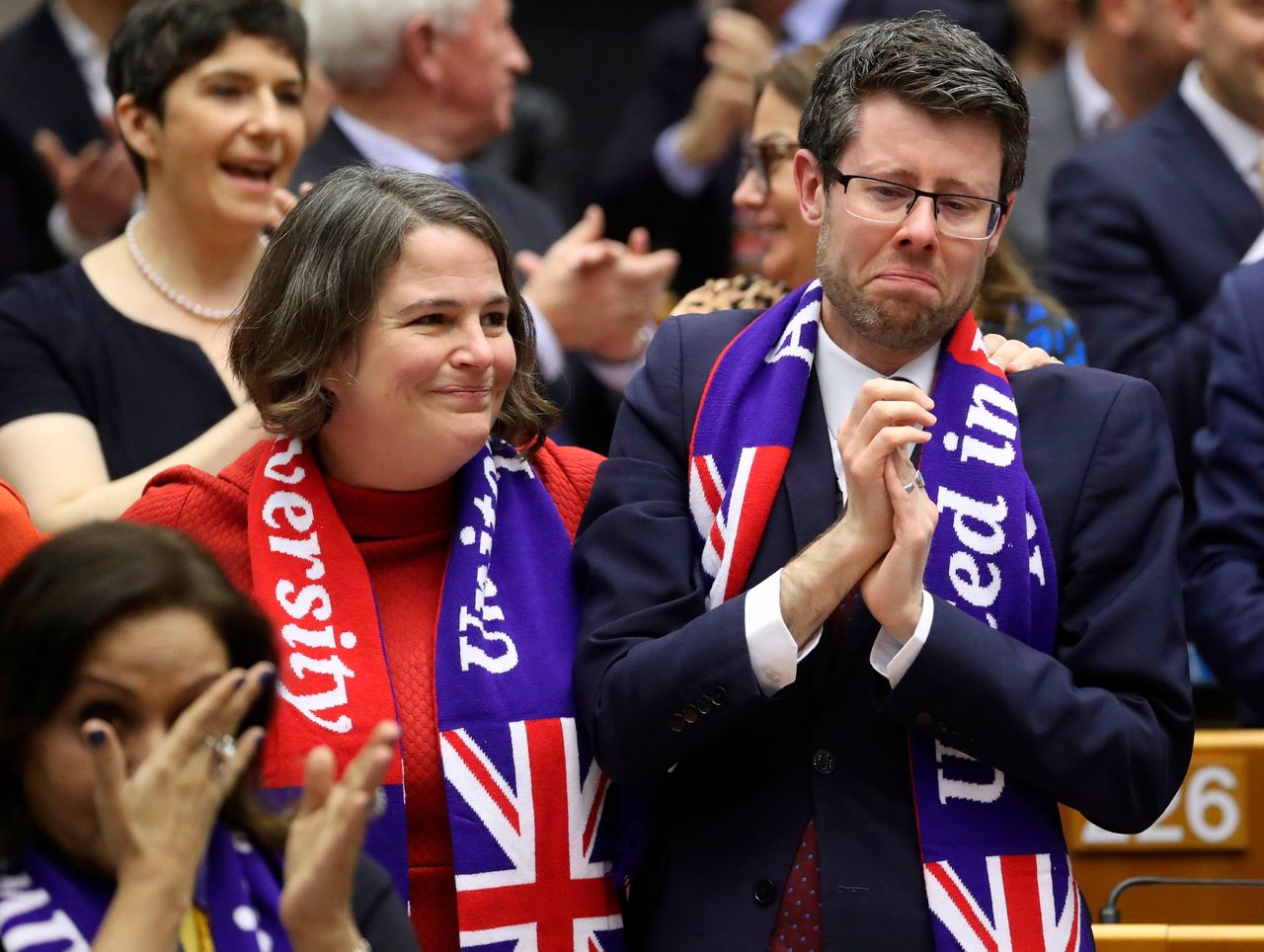 Rory Palmer (R) and Jude Kirton-Darling (L) react after the European Parliament ratified the Brexit deal during a plenary session at the European Parliament in Brussels on January 29, 2020
