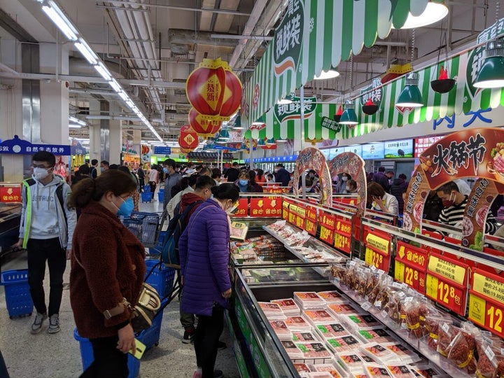 Everybody’s wearing masks by the hot pot meats aisle at Shenzhen’s Walmart.