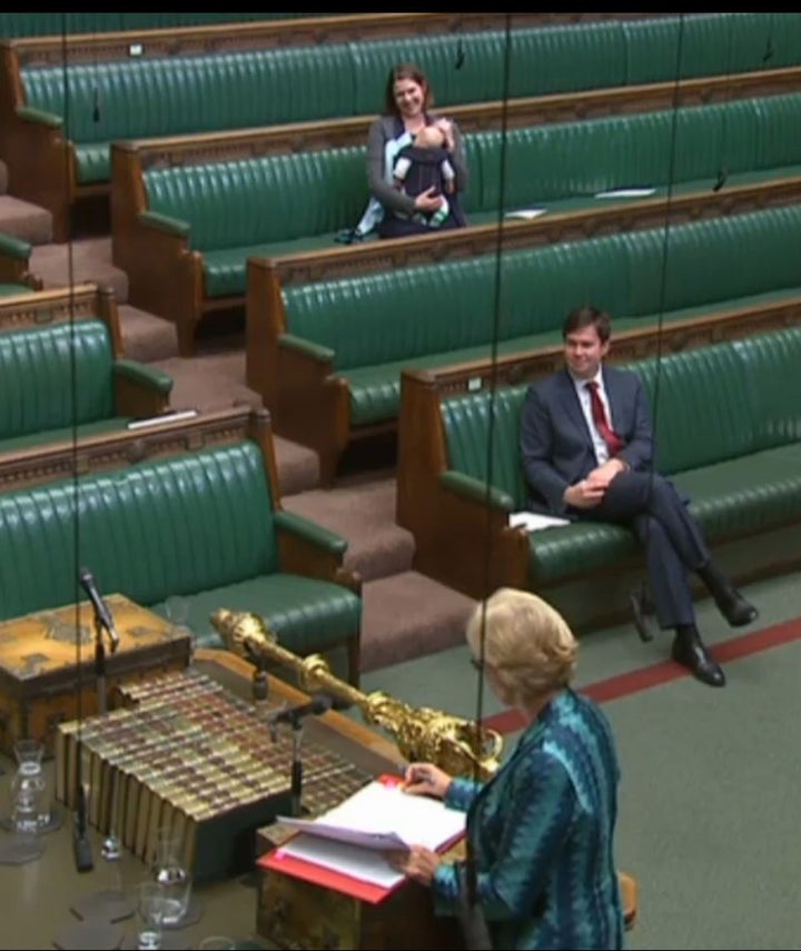 Jo Swinson with her baby Gabriel in her Commons seat to listen to the closing remarks of a discussion about proxy voting.