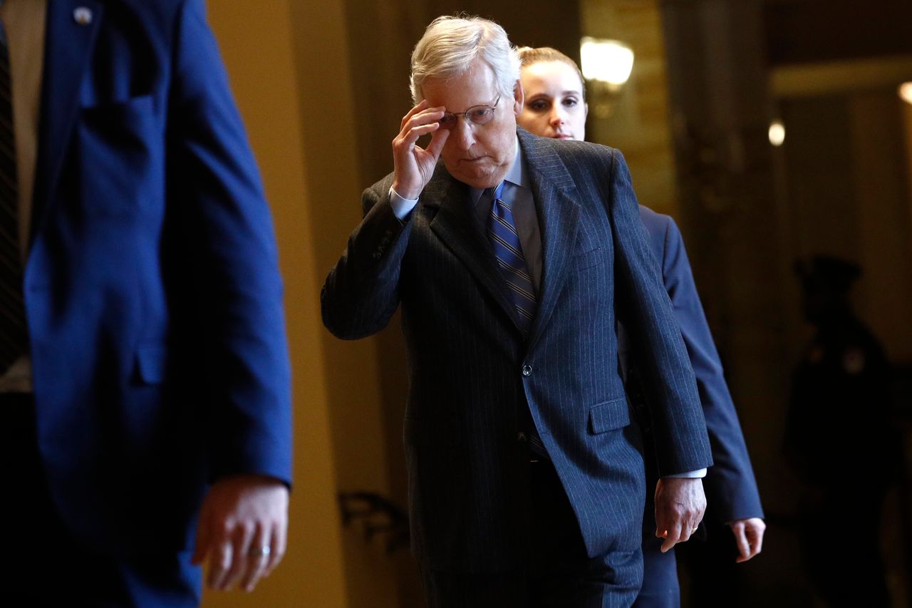 Senate Majority Leader Mitch McConnell (R-Ky.) walks to the Senate chamber before the start of the impeachment trial of President Donald Trump at the Capitol, Jan. 31, 2020.
