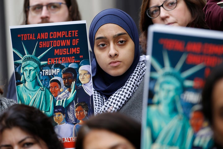 Demonstrators rally outside the U.S. Court of Appeals for the 4th Circuit on Jan. 28, 2020, in Richmond, Virginia, where arguments over President Donald Trump's travel ban were being heard.