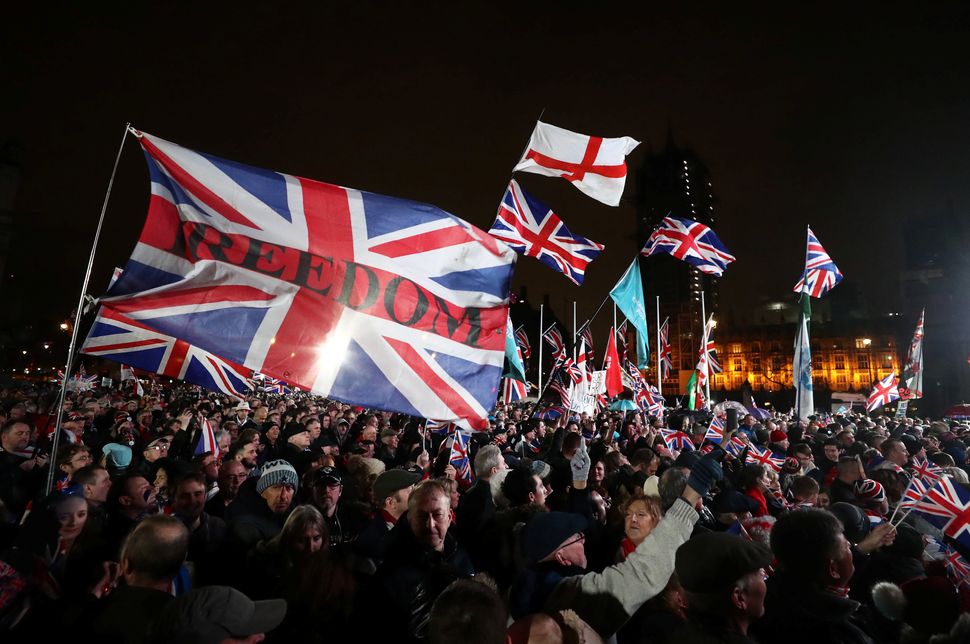Pro-Brexit demonstrators celebrate on Parliament Square on Brexit day in London, Britain January 31, 2020. REUTERS/Simon Dawson