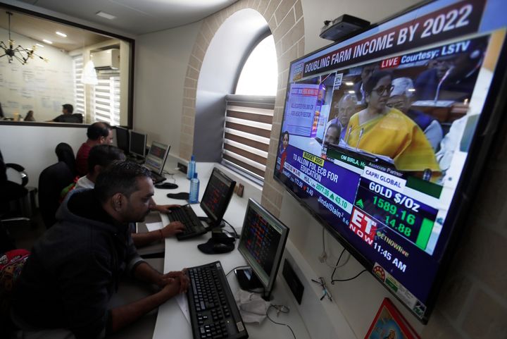 Brokers work at their computer terminal at a stock brokerage firm in Mumbai, India, February 1, 2020.