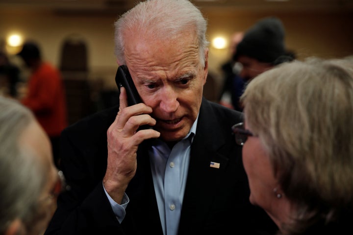 Biden talks on the phone with Ann Cahoon's son during a campaign event in Fort Madison, Iowa, on Jan. 31.