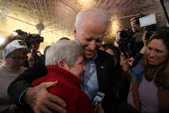 Former Vice President Joe Biden greets a voter during a campaign event on Jan. 31, 2020, in Burlington, Iowa.