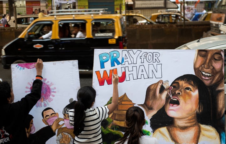 MUMBAI, INDIA - JANUARY 29: Art students make paintings to raise awareness about corona virus, at Lalbaug, on January 29, 2020 in Mumbai, India. (Photo by Satish Bate/Hindustan Times via Getty Images)