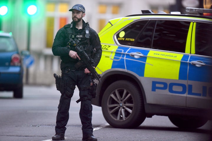 Armed police at the scene in Streatham High Road, south London after a man was shot dead by armed officers, with police declaring the incident as terrorist-related.