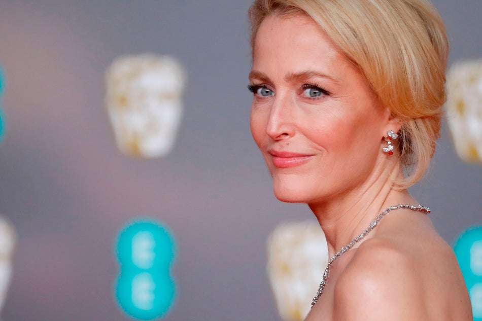 US actress Gillian Anderson poses on the red carpet upon arrival at the BAFTA British Academy Film Awards at the Royal Albert Hall in London on February 2, 2020. (Photo by Tolga AKMEN / AFP) (Photo by TOLGA AKMEN/AFP via Getty Images)