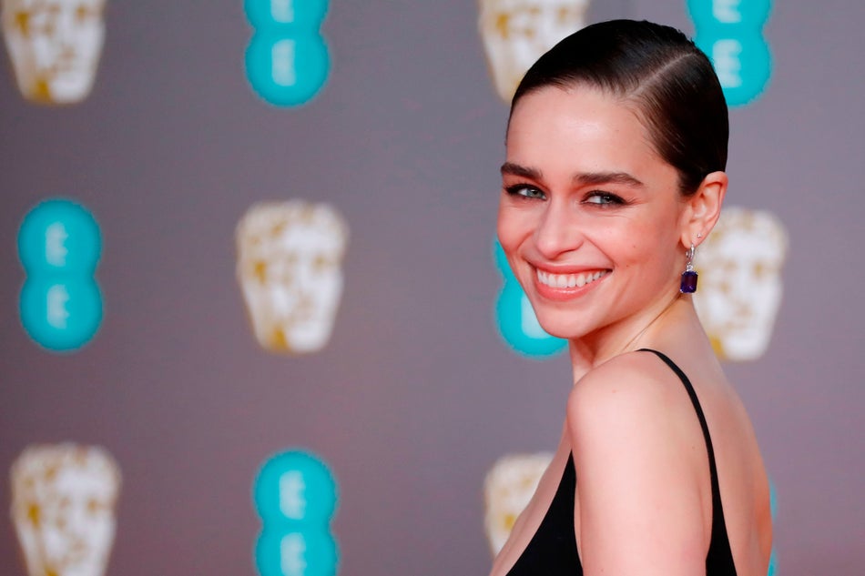 British actress Emilia Clarke poses on the red carpet upon arrival at the BAFTA British Academy Film Awards at the Royal Albert Hall in London on February 2, 2020. (Photo by Tolga AKMEN / AFP) (Photo by TOLGA AKMEN/AFP via Getty Images)
