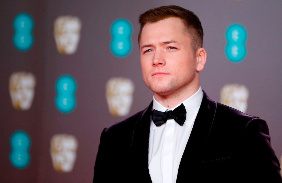 British actor Taron Egerton poses on the red carpet upon arrival at the BAFTA British Academy Film Awards at the Royal Albert Hall in London on February 2, 2020. (Photo by Tolga AKMEN / AFP) (Photo by TOLGA AKMEN/AFP via Getty Images)