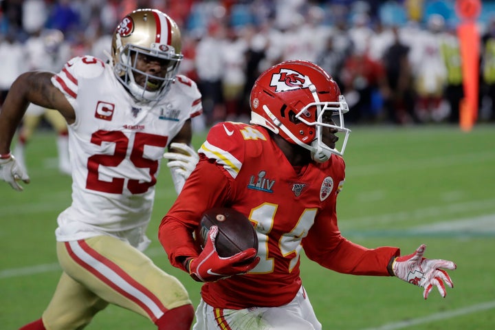 Kansas City Chiefs' Sammy Watkins (14) runs in front of San Francisco 49ers' Richard Sherman (25) during the second half of the NFL Super Bowl 54 football game Sunday, Feb. 2, 2020, in Miami. 