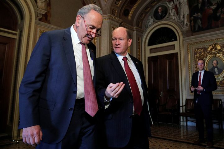 U.S. Senate Minority Leader Chuck Schumer (D-N.Y.) and Sen. Chris Coons (D-Del.) walk together prior to the resumption of the Senate impeachment trial of U.S. President Donald Trump at the U.S. Capitol in Washington, U.S., Jan. 31, 2020.