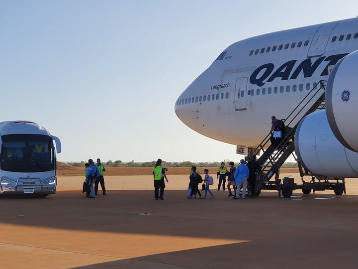 Australian evacuees from Wuhan, China arrive at RAAF base Learmonth in Western Australia on board a chartered Qantas Boeing 747-400 plane prior to their quarantine at Christmas Island.