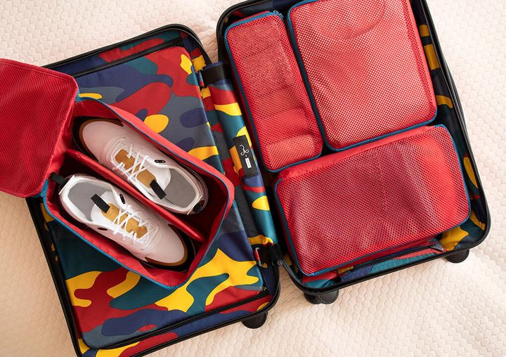 The collection features two suitcases, packing cubes and a shoe cube. 