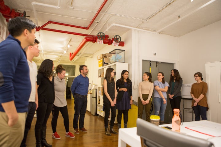 In an improv workshop, participants practice having conversations.