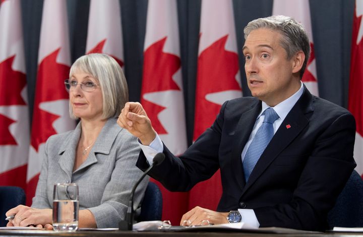 Minister of Health Patty Hajdu looks on as Foreign Affairs Minister Francois-Philippe Champagne responds to a question during an update on the coronavirus situation on Feb. 3, 2020 in Ottawa. 