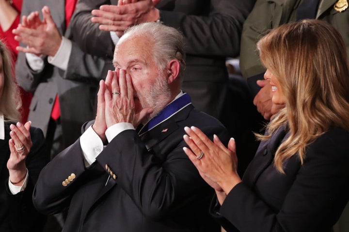 Conservative radio talk show host Rush Limbaugh reacts as he is awarded the Presidential Medal of Freedom by U.S. First Lady