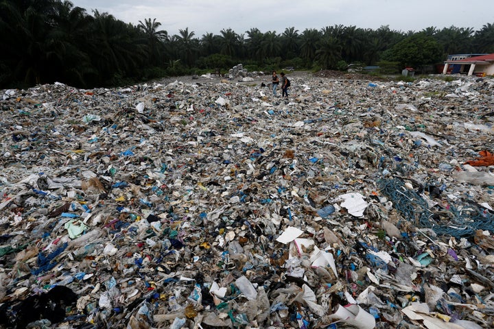 Plastic waste are piled outside an illegal recycling factory in Jenjarom, Kuala Langat, Malaysia on Oct. 14, 2018. 