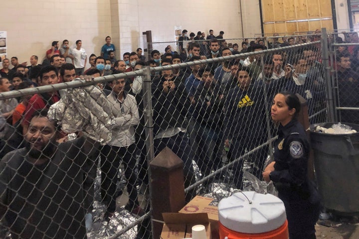 People forced to stand in small, enclosed spaces at a detention center in McAllen, Texas, during a visit by Vice President Mike Pence.