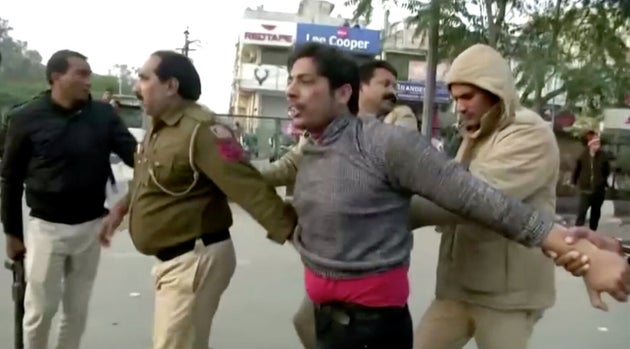 Kapil Gujjar (being detained by Delhi Police in the image) opened fire at Shaheen Bagh on February 1,...