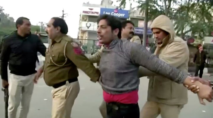 Kapil Gujjar (being detained by Delhi Police in the image) opened fire at Shaheen Bagh on February 1, just a week before the Delhi election.