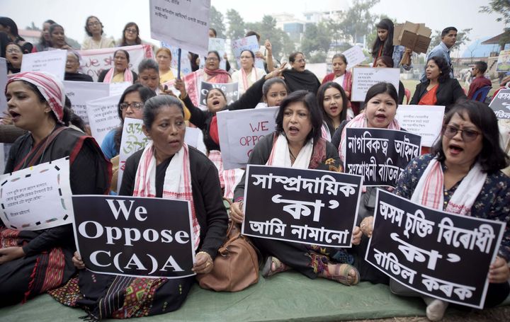 Protesters shout slogan during a protest against the new citizenship law in Guwahati.