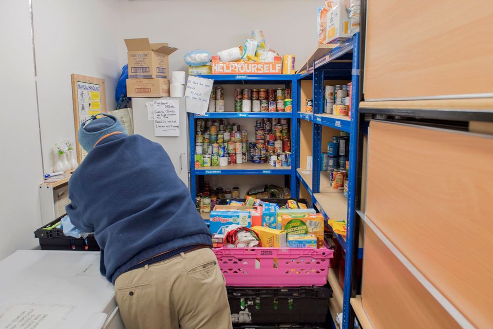 A foodbank volunteer stores donations at St John's Church before distributing them to local foodbanks on January 28, 2019, in Stalybridge