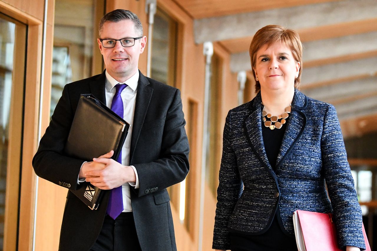 Former finance secretary Derek Mackay and First Minister of Scotland Nicola Sturgeon at the Scottish Parliament in 2018