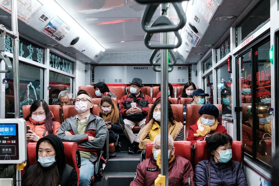 People wearing surgical masks on a bus in Taipei, Taiwan