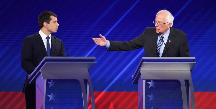 Democratic presidential hopefuls Mayor of South Bend, Indiana, Pete Buttigieg (left) and Sen. Bernie Sanders of Vermont (right) speak during the third Democratic primary debate of the 2020 presidential campaign season on Sept. 12, 2019.