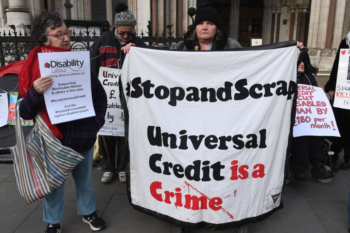 Campaigners outside the Royal Courts of Justice in London supporting the legal challenge against the Government�s Universal Credit welfare scheme.