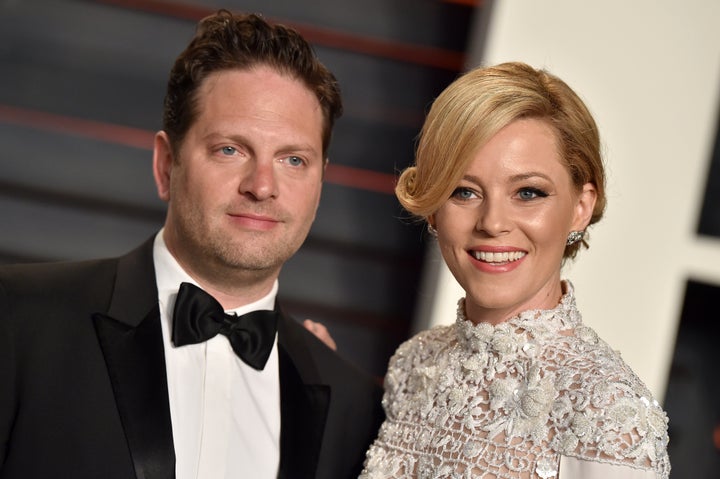 Elizabeth Banks and her husband, Max Handelman, were college sweethearts who wed in 2003. Here, they arrive at the 2016 Vanity Fair Oscar party in Beverly Hills, California.