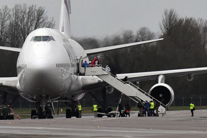 Passengers disembarking an aircraft repatriating British and other nationalities to the UK from the coronavirus-hit city of Wuhan in China, arrives at RAF Brize Norton in Oxfordshire.