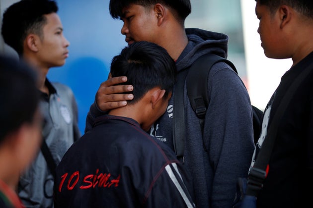 Victim's family members cry in front of the Terminal 21 shopping mall following a gun battle involving a Thai soldier on a shooting rampage, in Nakhon Ratchasima, Thailand February 9, 2020. REUTERS/Soe Zeya Tun