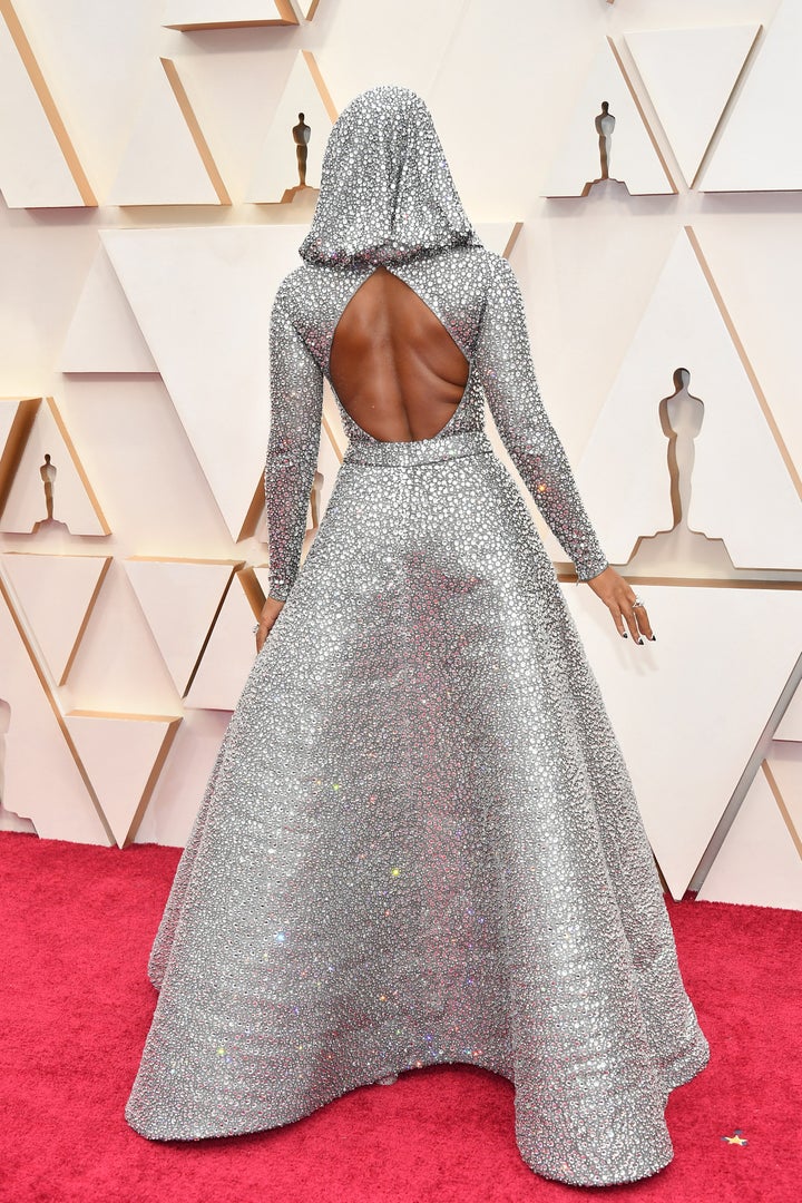 Monáe showed the detail of her custom Ralph Lauren gown on the Oscars red carpet on Sunday in Los Angeles.