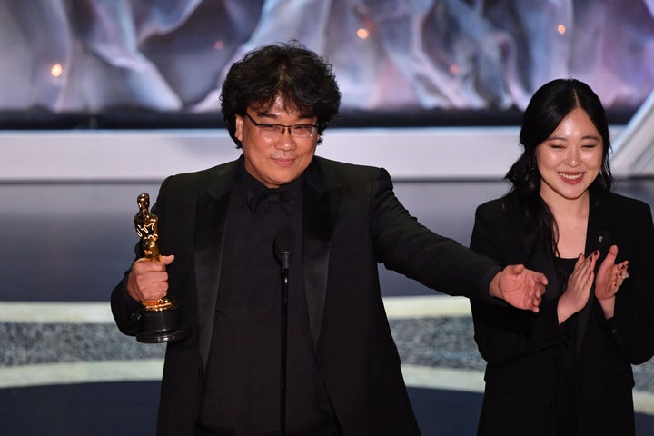 Bong Joon-ho, alongside translator Susan Choi, accepting the award for Best International Feature Film on Feb. 9, 2020.