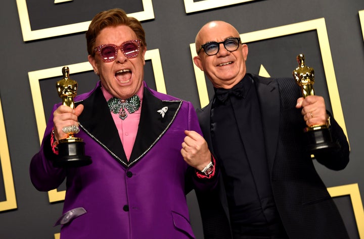 Elton John and Bernie Taupin with their Best Original Song Oscar for in the press room at the 92nd Academy Awards.